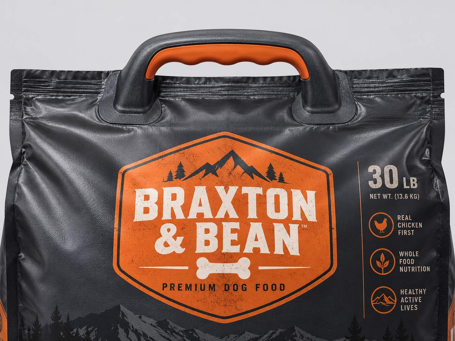 A large kibble bag with an applied plastic carry handle bonded to the outside, being lifted by a customer to show how the strap spreads the load